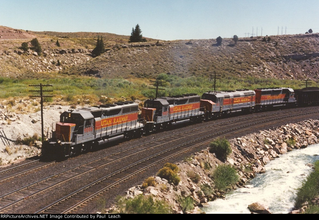 Loaded coal train climbs upgrade